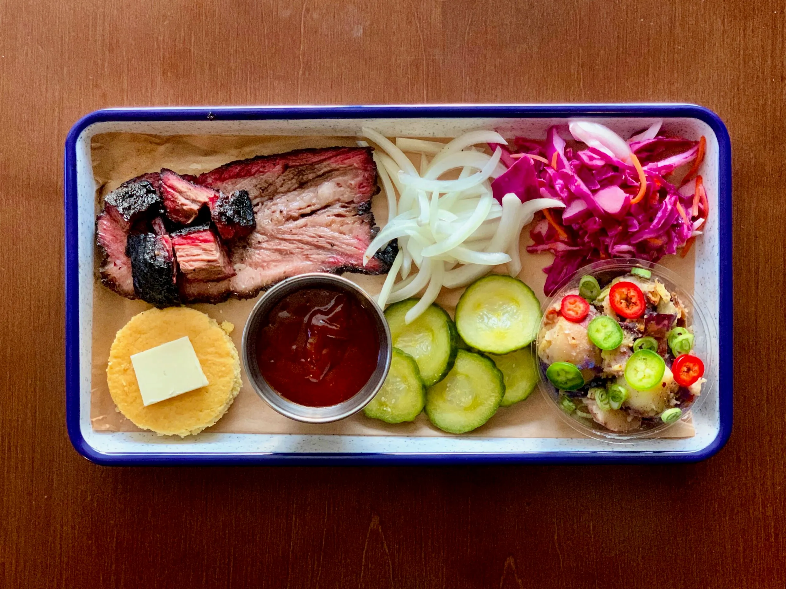 A spread of ZEF BBQ smoked meats and sides